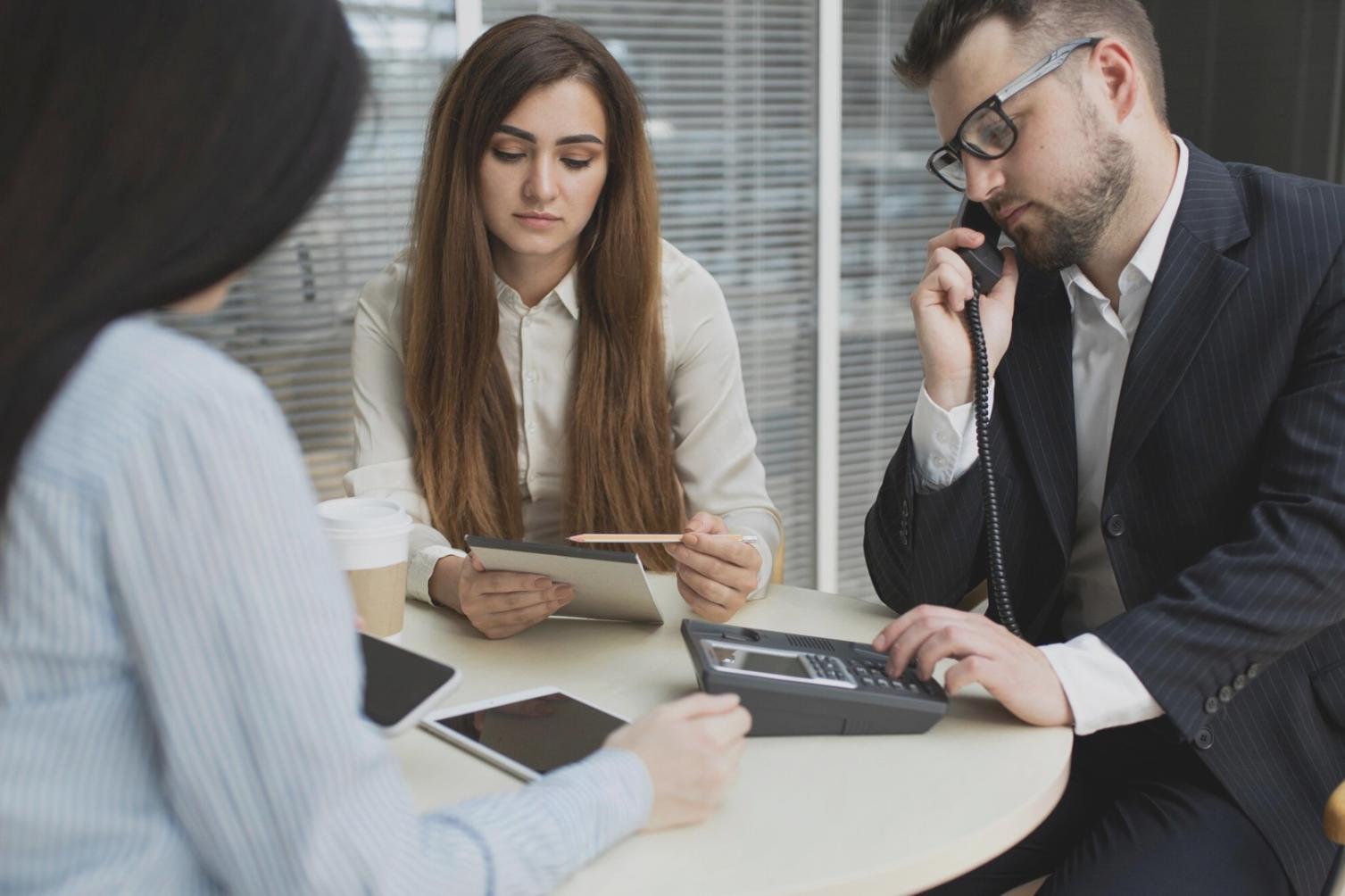 Modern investment research office with market analysis displays